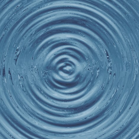 Grey ripples being formed on the water surface