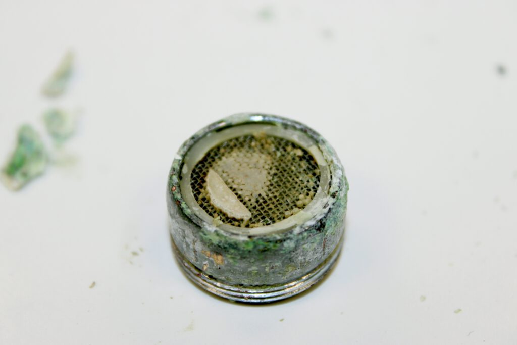 A dirty water faucet part.