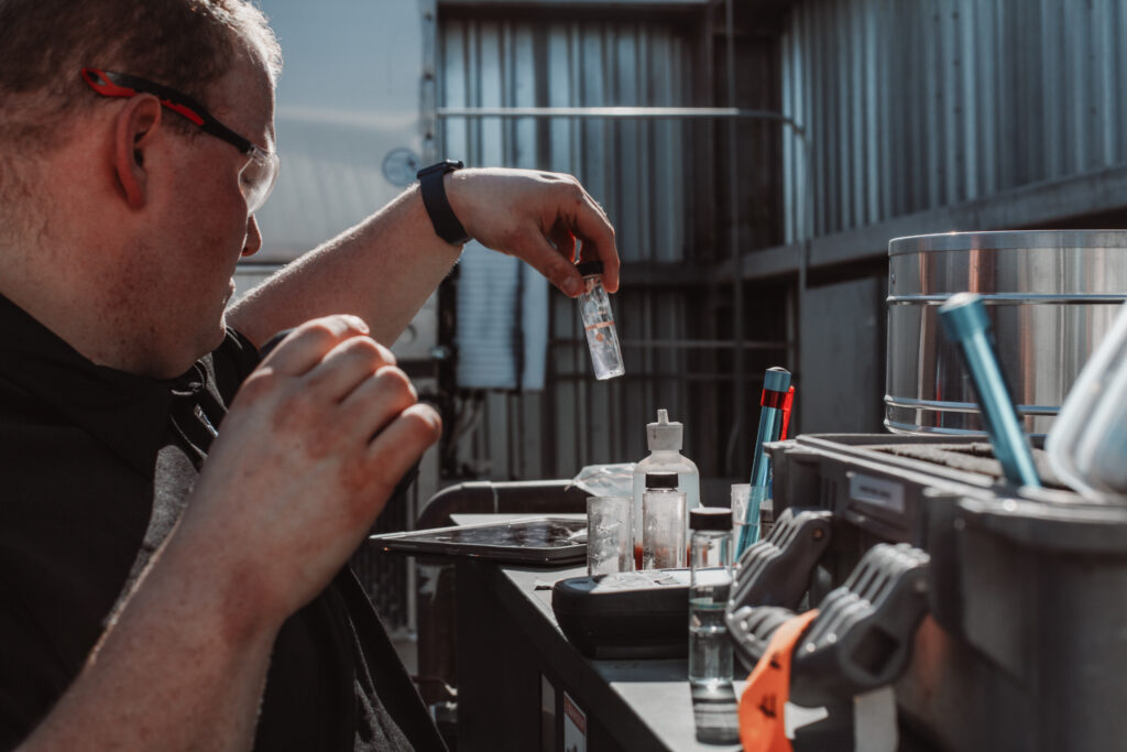 A technician reviews a water sample.