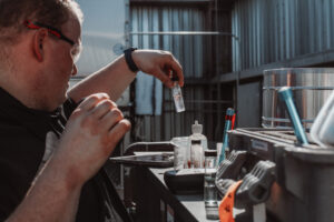 A technician reviews a water sample.